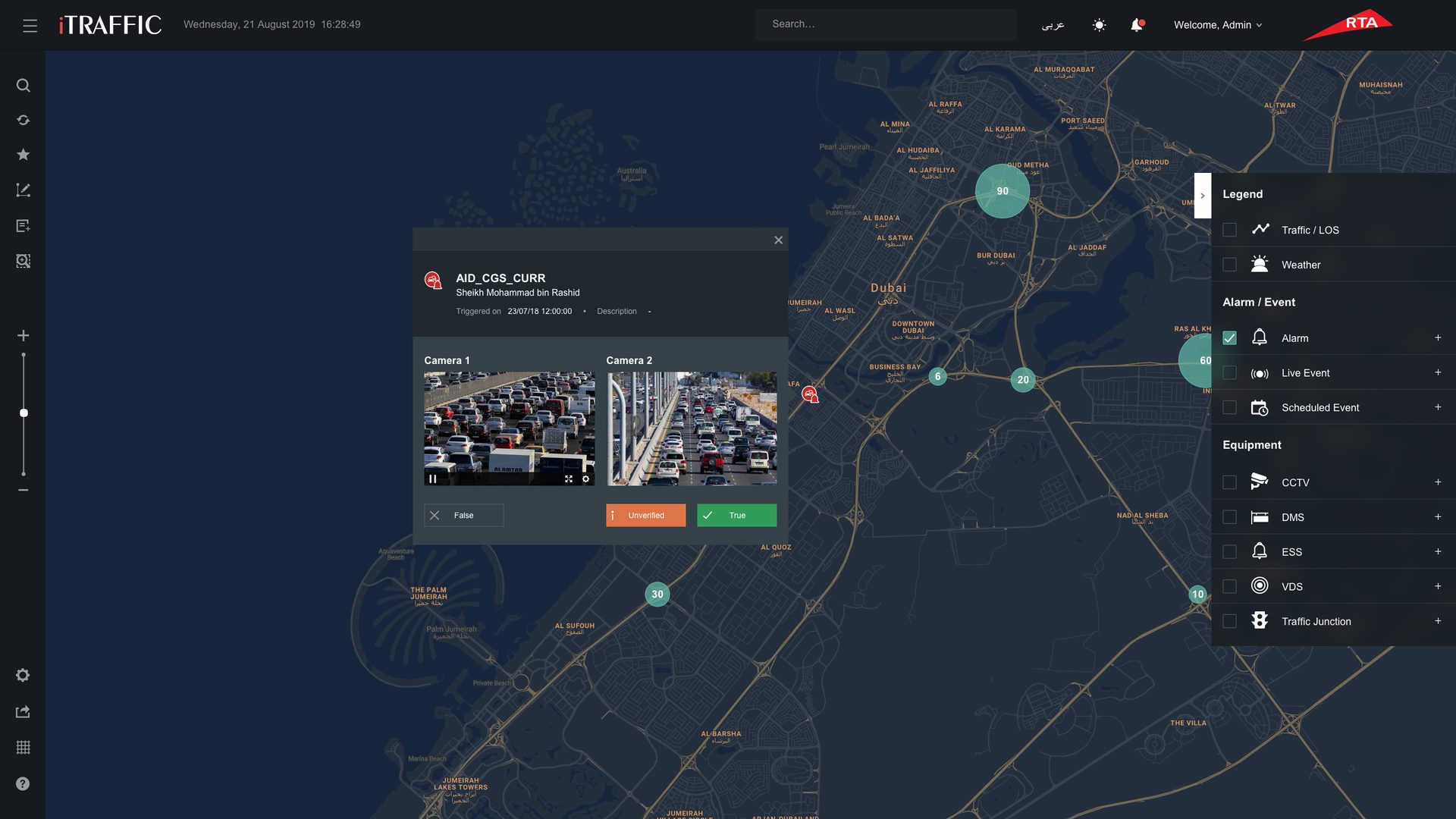 Map of Dubai with an alarm open, showing two live camera feeds and buttons to mark it false, unverified or true